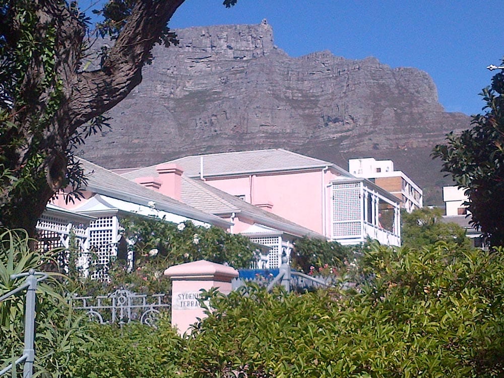 Pink house with mountain backdrop