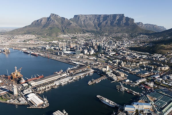 Aerial view of Cape Town's harbour and mountains.